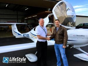 Shaking Hands in front of a DA40